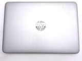 a laptop that is sitting on a white table
