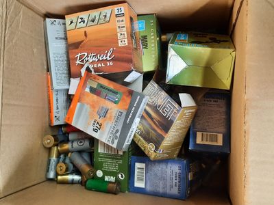 a cardboard box filled with assorted items like cigarettes and cigarettes
