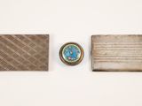 three different types of metal items are displayed on a white surface