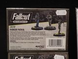 a box of fallout and a box of fallout action figures
