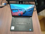 a laptop that is sitting on a desk next to a monitor