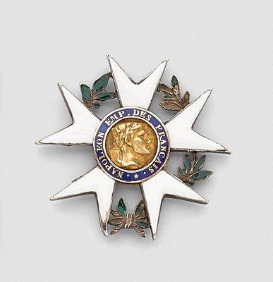 a gold medal with a blue and white design on it