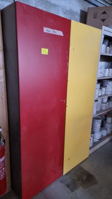 a fire extinguisor next to a fire hydrant in a warehouse