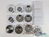 a lot of different types of circular saw blades on the table