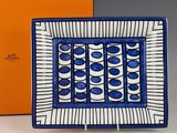 an image of a blue and white plate with a box in the background