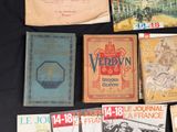several books are laid out on a table with a black background