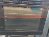 a black oven that is sitting in the kitchen