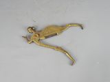 brass plated figurine of a woman holding a sword