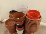 many pots sitting on a pallet on the floor