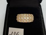 a close up of a ring in a black box with a price tag