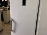 two white refrigerators sitting next to each other in a kitchen