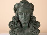 an image of a statue of a woman ' s head on a table