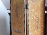 two old books that are sitting on a shelf