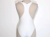 a mannequin with a white bodysuit on a mannequin stand