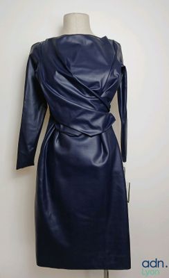 the dress is made of leather and has long sleeves