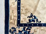 a blue and white rug with a picture on it