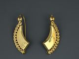 a pair of gold earrings with a curved design