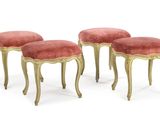 three small stools with gold legs and pink velvet upholstered seats