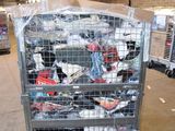 a metal cart with many items in it in a warehouse