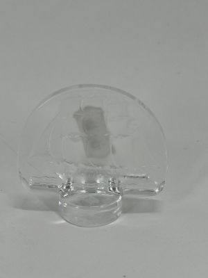 clear glass figurine of a man with a hat on his head
