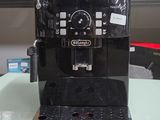 a black coffee machine sitting on a table in a store