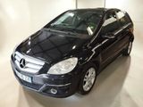 a picture of a black mercedes b - class parked in a garage
