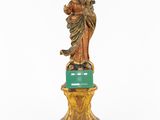 a statue of a woman holding a child on top of a pedestal