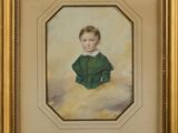 portrait of a young boy in a green jacket