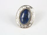 a close up of a silver ring with a blue stone in it