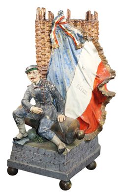 statue of two men sitting on top of a statue of a castle