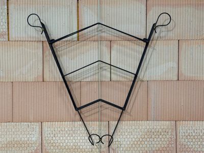 a picture of a wall hanging on the side of a building