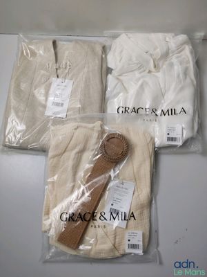 three pieces of cloth are wrapped in plastic bags on a table