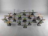 a lot of toy airplanes that are sitting on a table