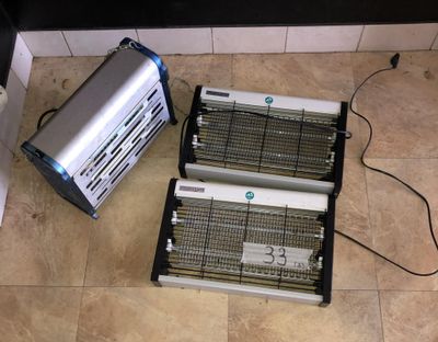 two electric heaters sitting on the floor next to each other