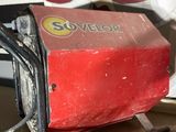a red machine that is sitting on top of a table