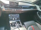 a picture of a car dashboard with a radio and a steering wheel