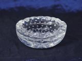 a glass bowl with a black and white design on it