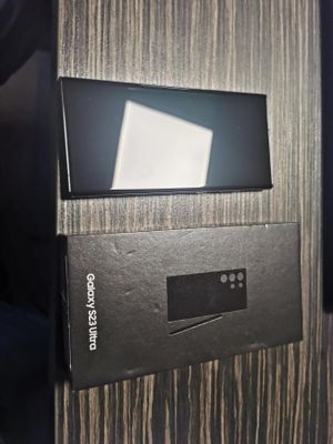 a box that has a remote in it on top of a table