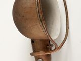 a light that is hanging on the wall next to a mirror