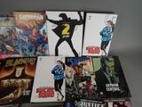 the covers of the comic books are lined up on the table