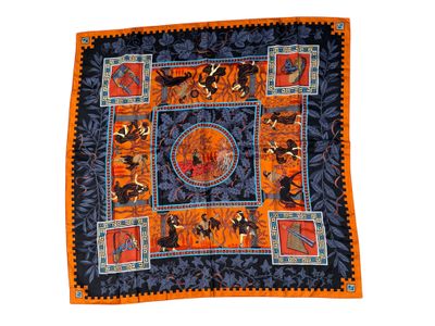an orange and blue banda with a picture of a man riding horses