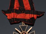 une image représentant une médaille ornée d'un ruban et d'une croix