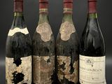 trois bouteilles de vin sont posées l'une à côté de l'autre sur une table