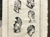 several drawings of men ' s heads are displayed on a piece of paper
