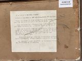 a piece of paper taped to a piece of cardboard with writing on it