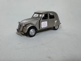 a toy car that is sitting on a white surface