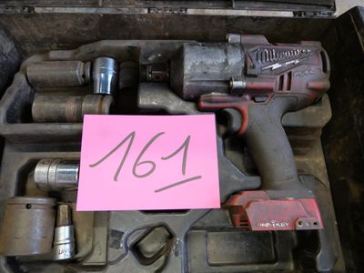 a box with tools in it and a pink note in it