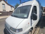 a white van that is parked on the side of the street