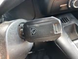 a close up of a car ' s dashboard with a remote control