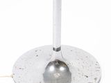 a small table with a glass top and a metal base